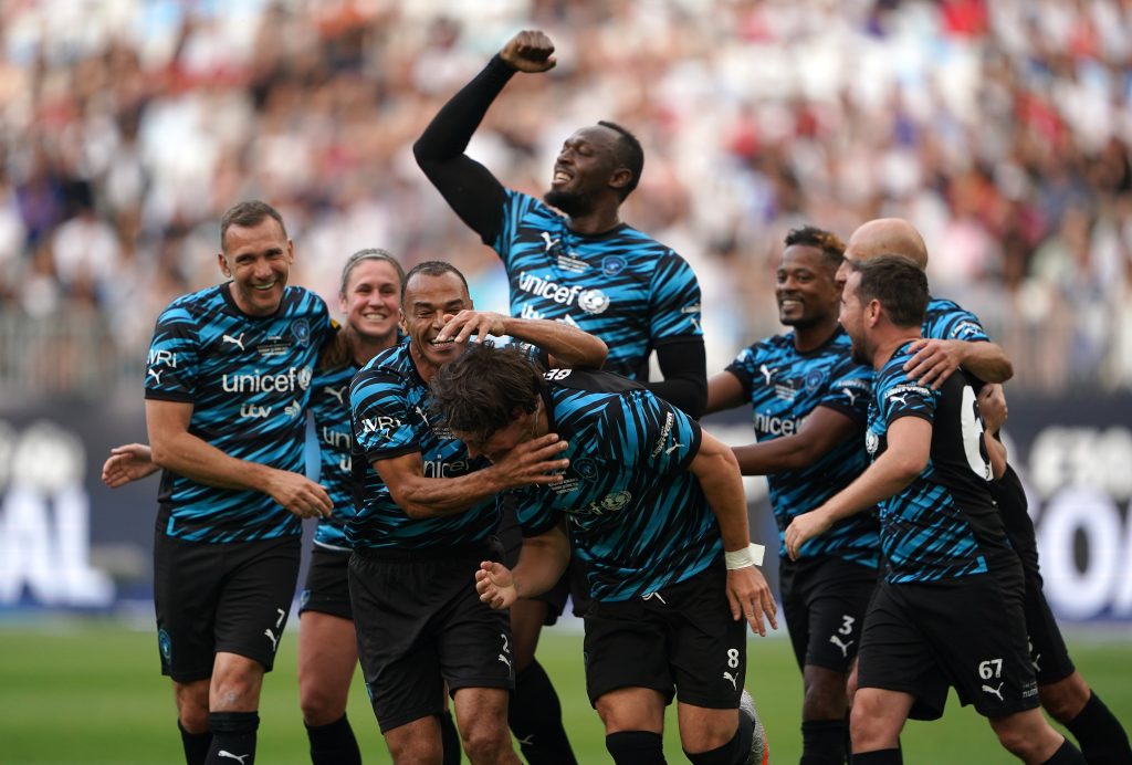 Crowd cheers during a thrilling Soccer Aid event
